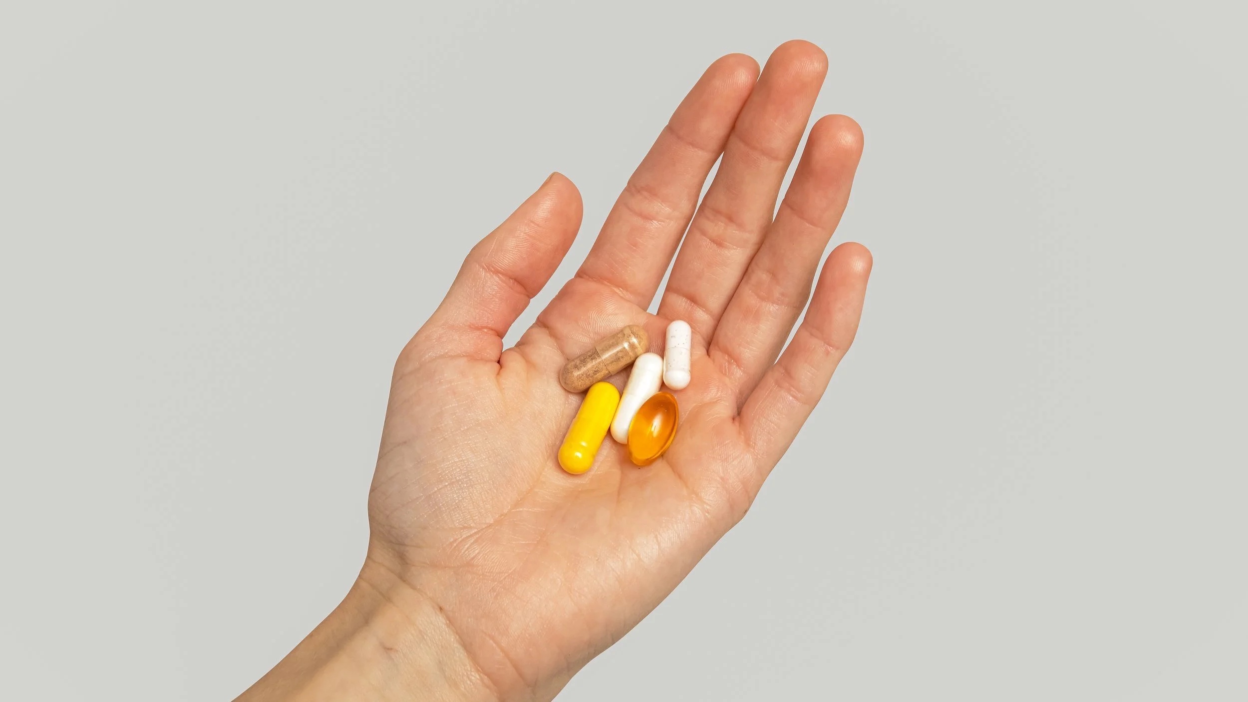 FlyKitt capsules held in an open palm