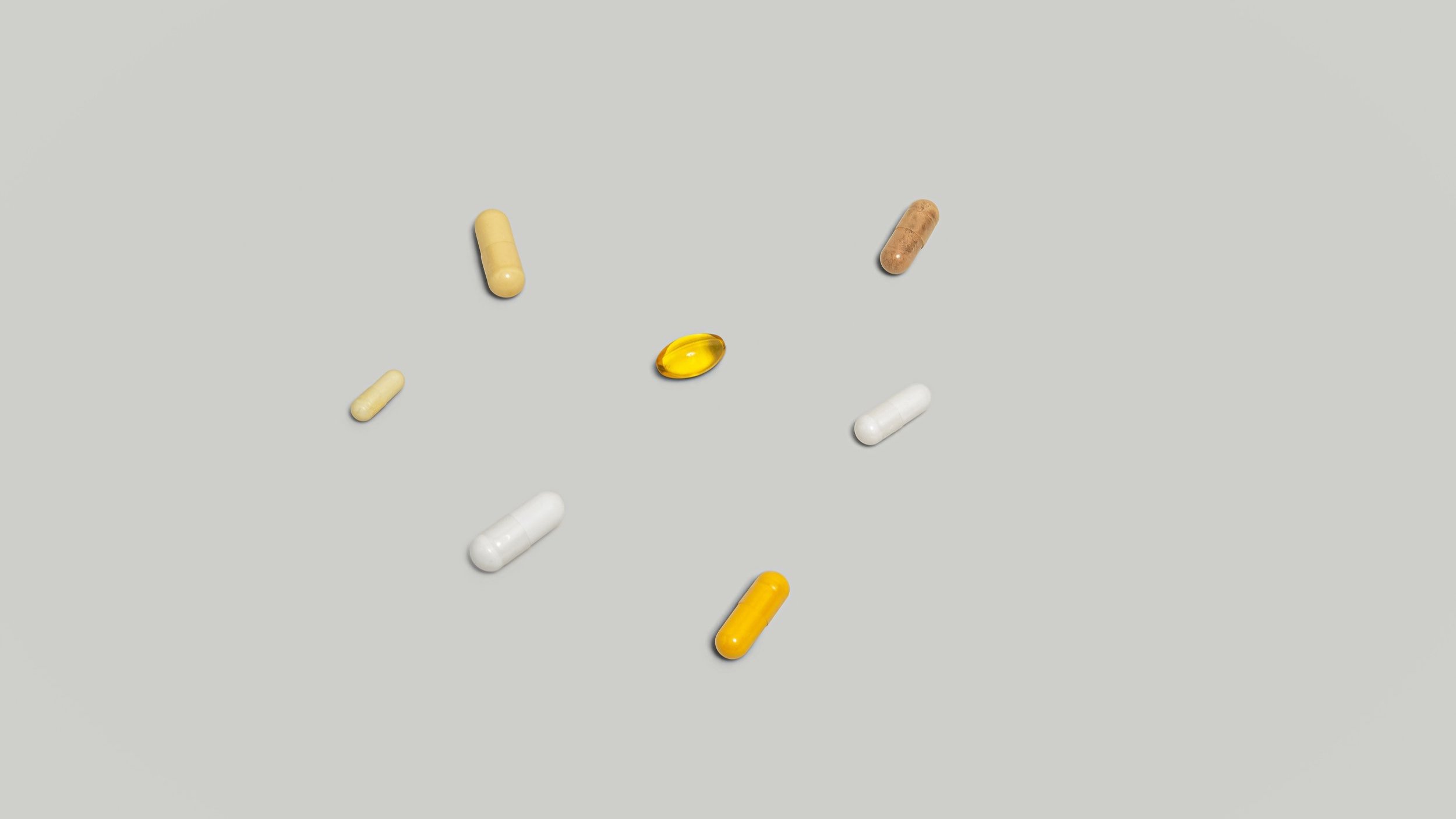 FlyKitt supplement capsules on a studio surface