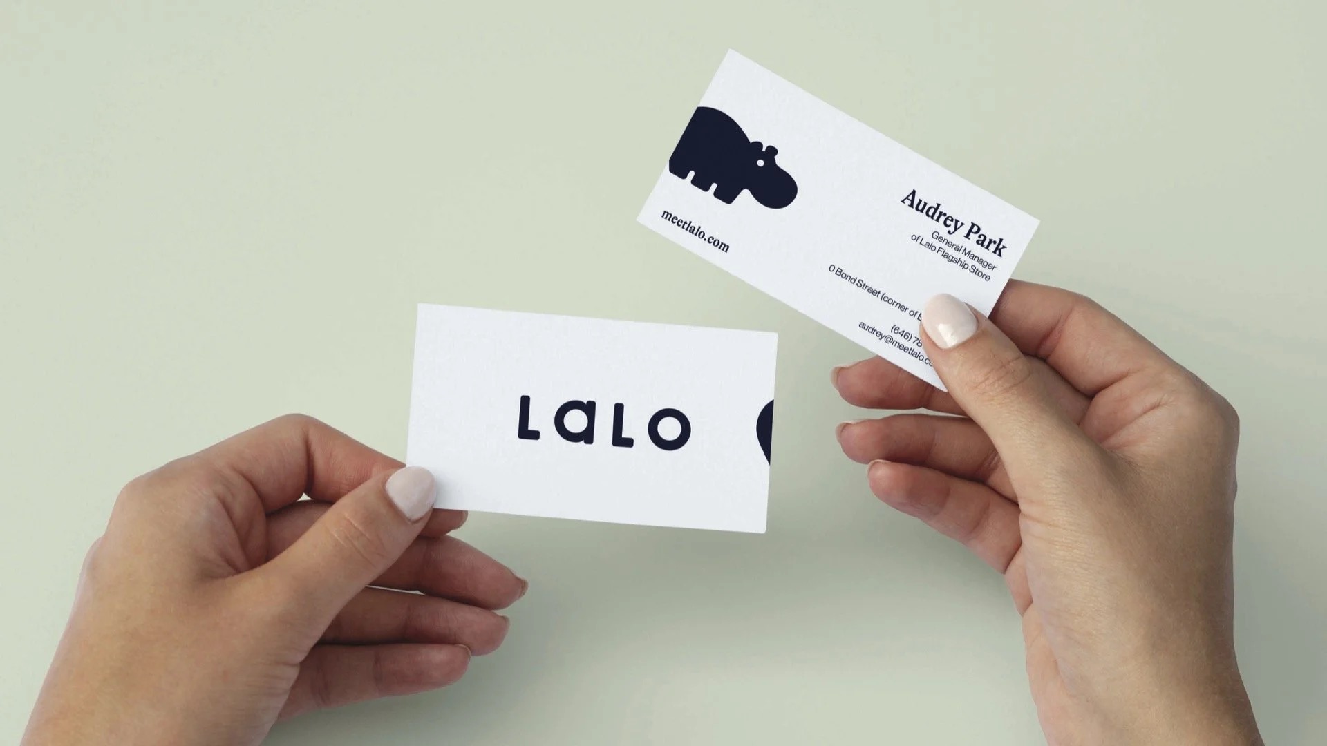Lalo white business cards held in hand